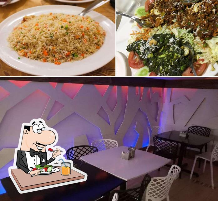 Take a look at the image depicting food and interior at The Graduate Restaurant