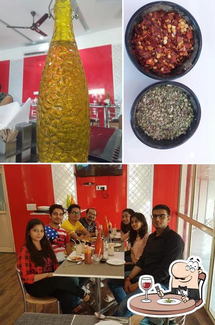 The Pizza House, Saifai is distinguished by food and dining table
