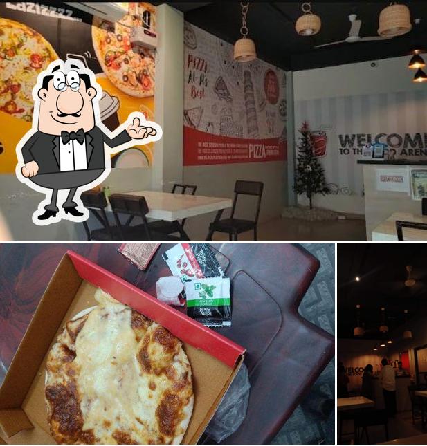 Take a look at the image showing interior and food at Laziz Pizza Hojai