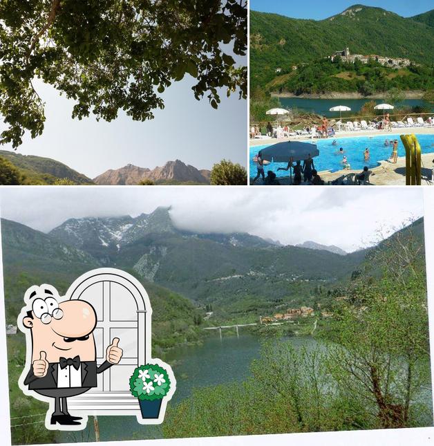 Puoi goderti l'aria fresca da seduto all'esterno di Albergo Ristorante Il Lago