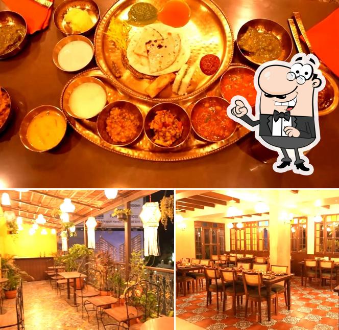 This is the image showing interior and food at Kathiyawadi darbar