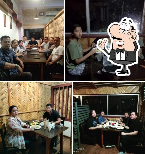 Take a seat at one of the tables at L T Mizo Belly Restaurant