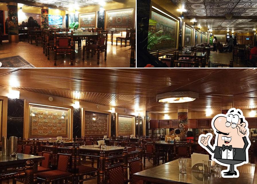 Take a seat at one of the tables at Hare Krishna Restaurant Pvt. Ltd
