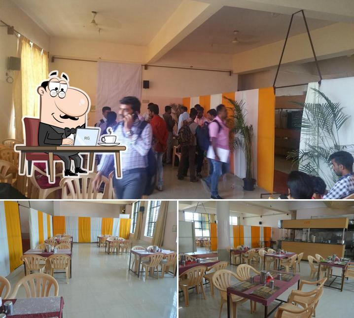 Take a seat at one of the tables at BALAJI FAMILY RESTAURANT