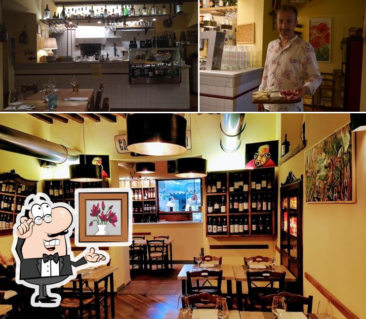 Dai un'occhiata agli interni di Il Gatto Re Osteria
