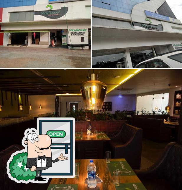 The image of MayFlower Restaurant and Catering Nadakkavu’s exterior and dining table