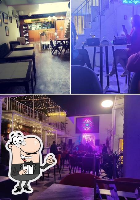 Take a seat at one of the tables at The Living Room - TLR Cafe