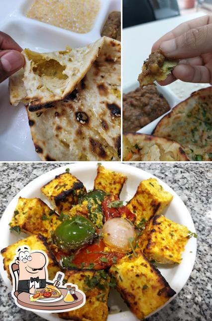Try out pizza at Bhole Chature