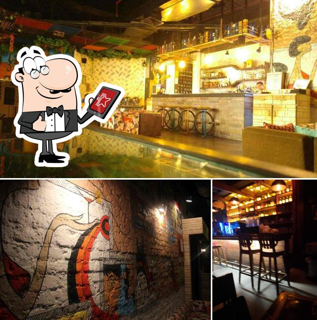 The picture of Aura Cafe & Resto Bar’s exterior and bar counter