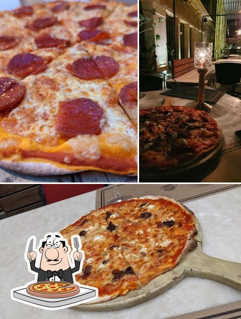 Get pizza at Baradari Restaurant & Bar