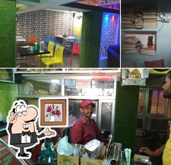 Take a seat at one of the tables at Saawariya Restaurent (Family Restaurant)