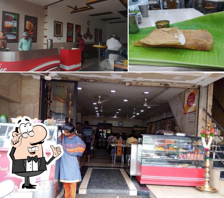 Take a seat at one of the tables at Sri Saraswathi Cafe