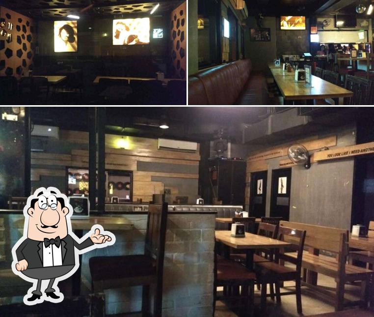 Take a seat at one of the tables at Gilly's Restobar