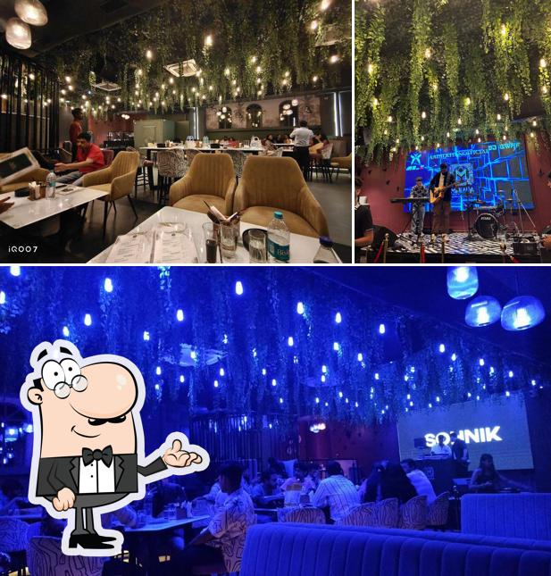 Take a seat at one of the tables at Mekada - Bar & Lounge