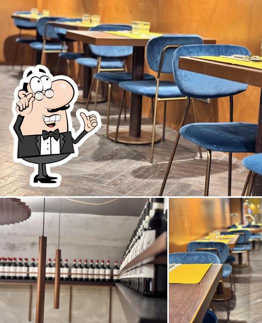 Dai un’occhiata alla foto che raffigura la interni e bevanda di Garbo Pizzeria