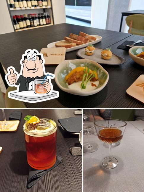 Tra le varie cose da Impronte Ristorante si possono trovare la bevanda e tavolo da pranzo