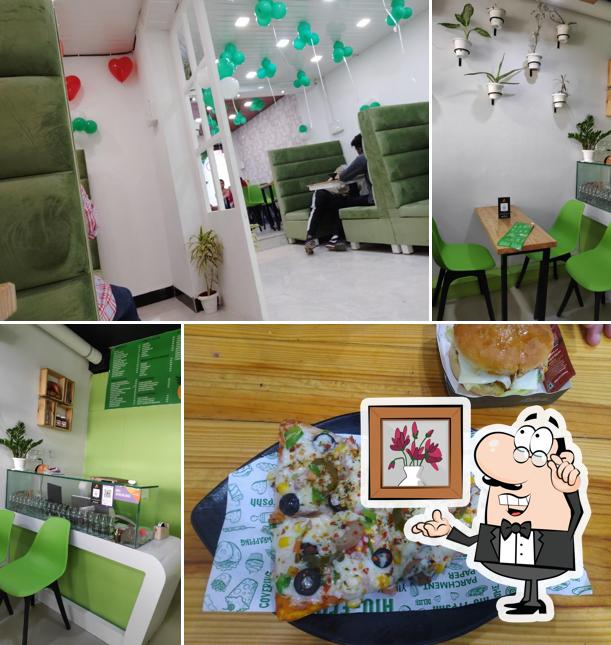 Take a seat at one of the tables at Circle of Joy Pizzas & more