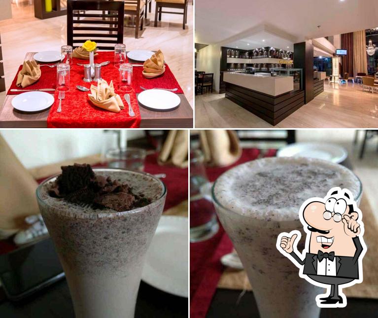 Check out the image showing interior and drink at Kaffeine