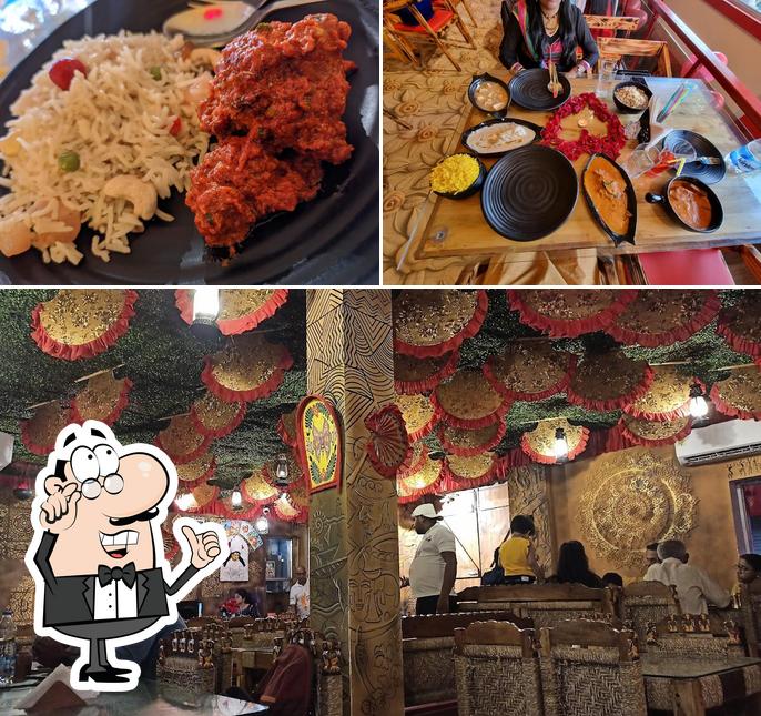 This is the image showing interior and dessert at Barfi The Food Magician