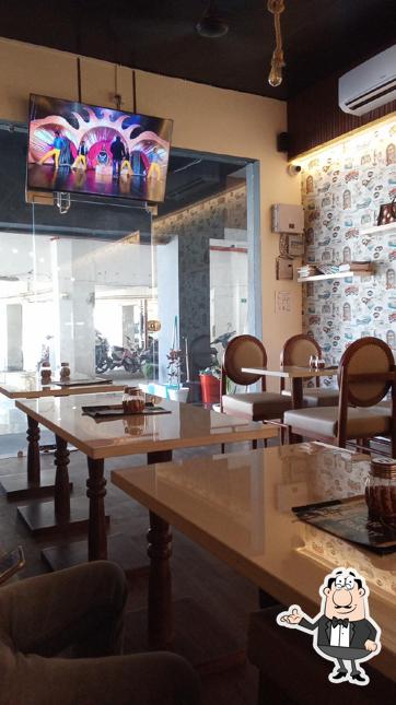 Take a seat at one of the tables at J N J CAFE