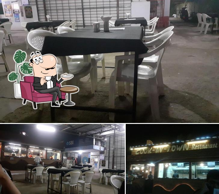 Take a seat at one of the tables at Cook In Town Restaurant