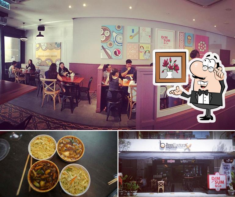 Take a look at the picture displaying interior and food at Dimsum & Co