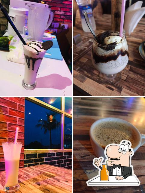 Enjoy a beverage at Hotel Step Up - Cafe & Restaurant(AC Non AC Rooms)