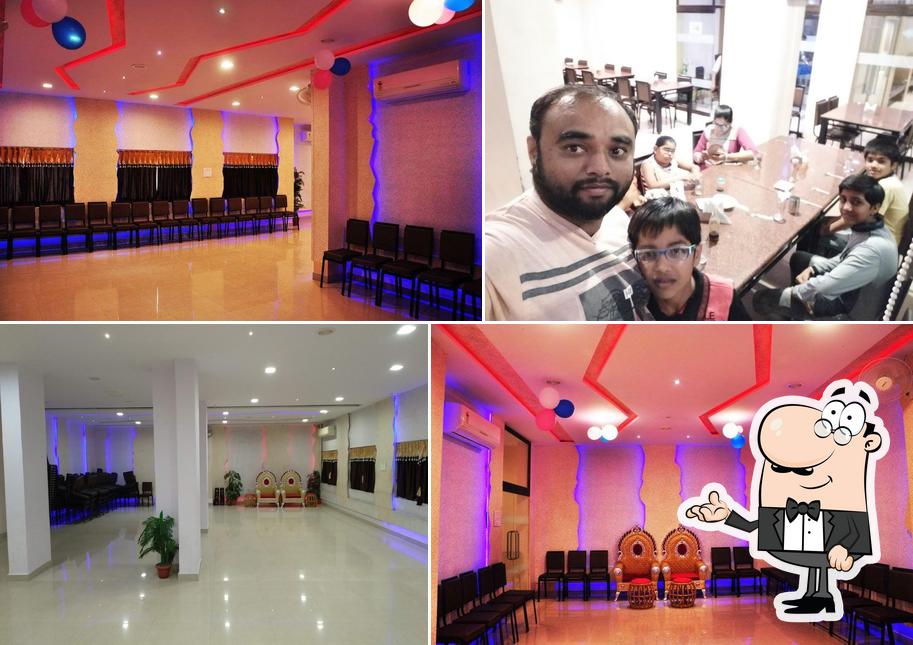 Take a seat at one of the tables at Rich Taste Restaurant & Banquet Hall