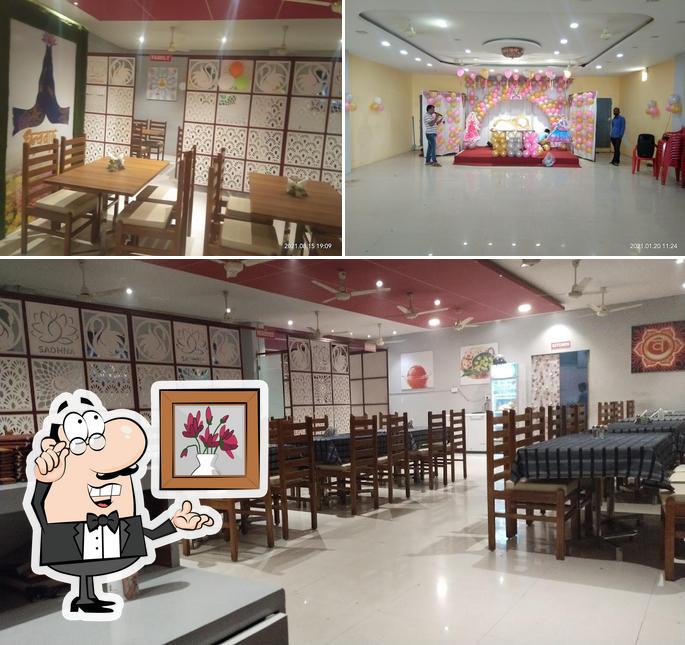 Take a seat at one of the tables at Sadhana Pure Veg