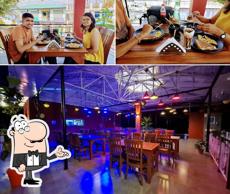 Take a seat at one of the tables at Alfresco Bir - Restaurant in Bir Billing Cafe in Bir Billing