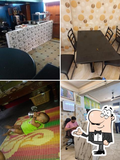 Take a seat at one of the tables at Sri Siddi Vinayaka Udipi Tiffins