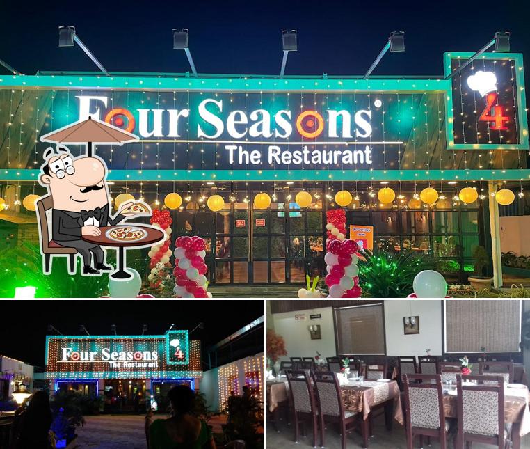 This is the image showing exterior and dining table at Four Seasons Restuarant