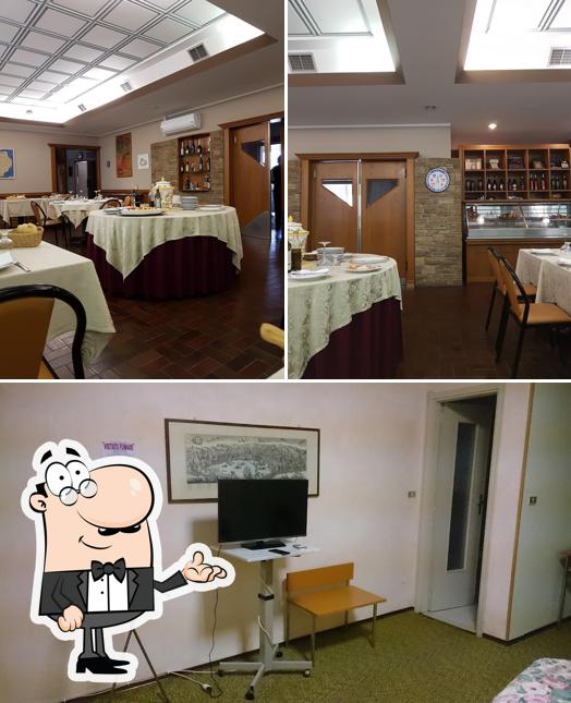Siediti a un tavolo di Hotel Ristorante Grappolo d'Oro