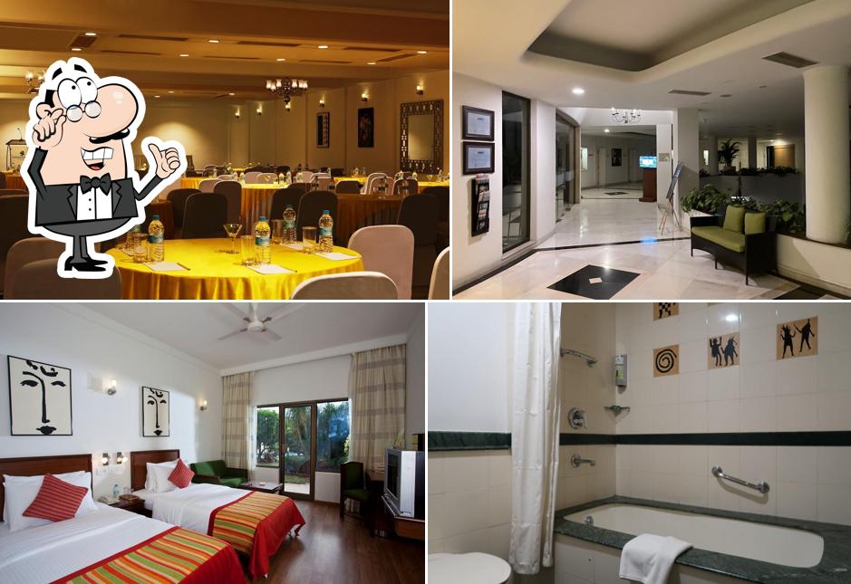 Take a seat at one of the tables at Lemon Tree Hotel, Aurangabad