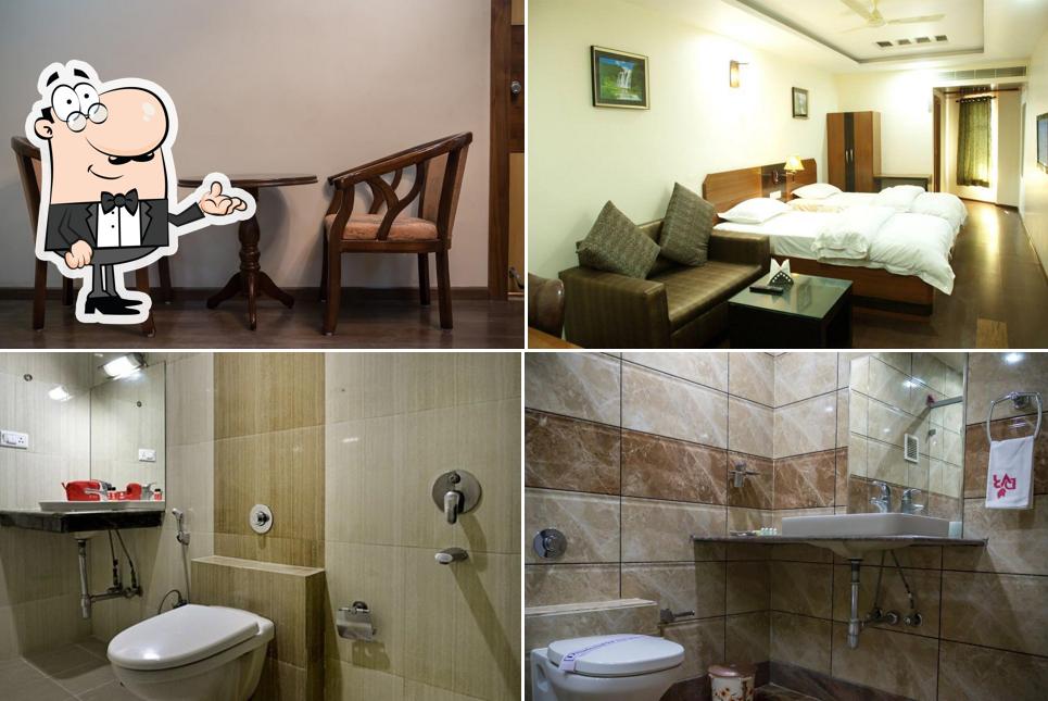 Take a seat at one of the tables at Hotel DVR Mansion