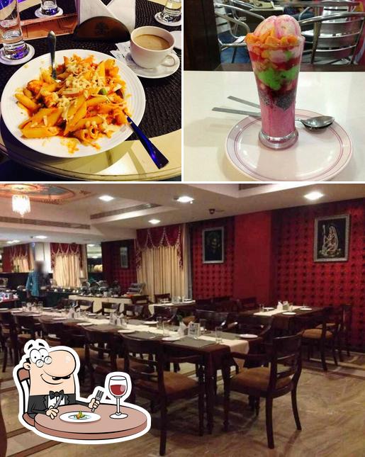 The photo of Cafe De Paris’s food and interior