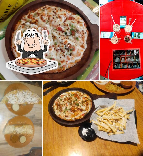 Pick pizza at Swami '$ Creamy Cafe