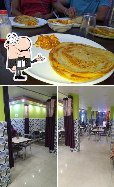 The photo of Biryani King A Family Restaurants’s interior and dining table