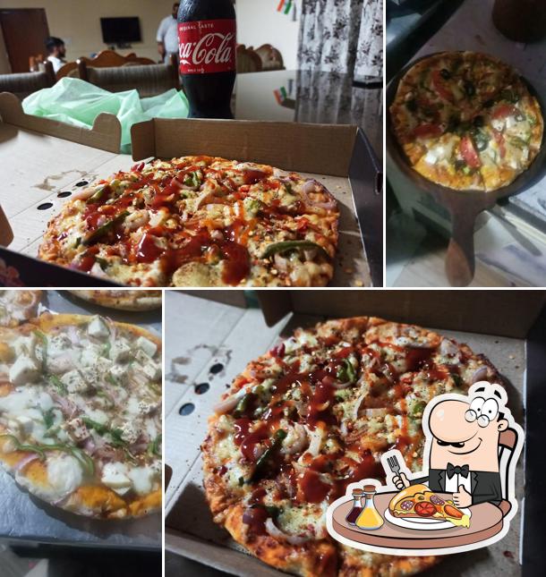Try out pizza at Tasty Bite Best Restaurant, Pub & Beer Bar AC Room Bhogpur