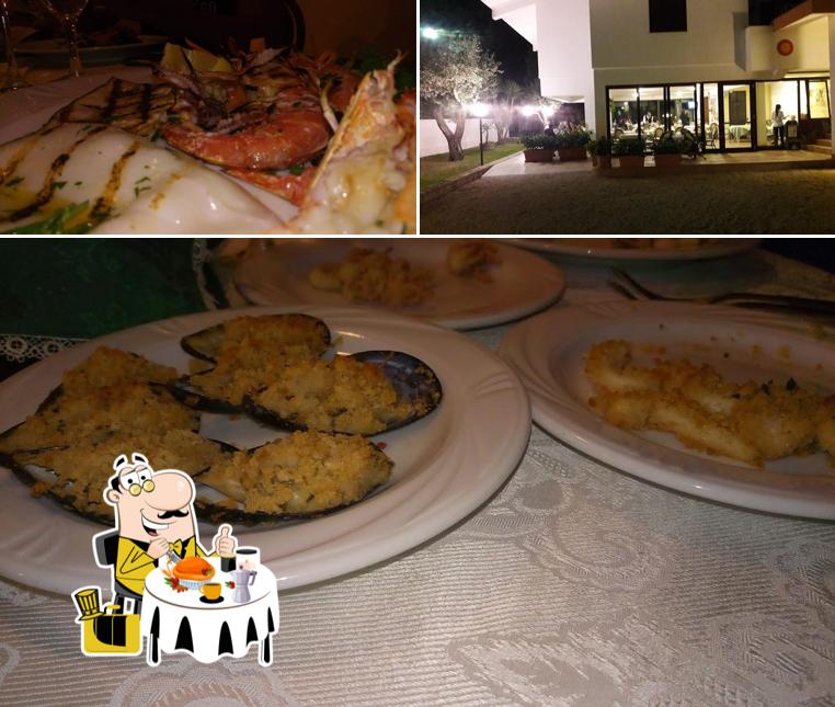 Questa è la immagine che presenta la cibo e interni di Ristorante L'Aura