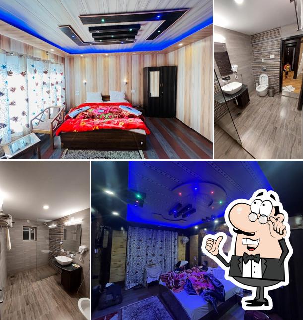 Take a seat at one of the tables at Hotel Sonamarg inn