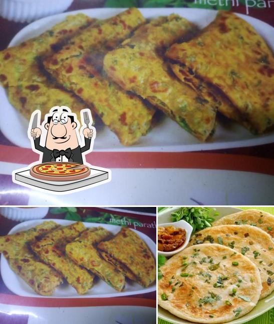 Get pizza at BN Parotha house
