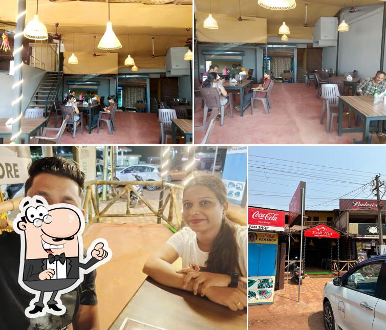 This is the image depicting interior and food at Fish Hut Family Restaurant