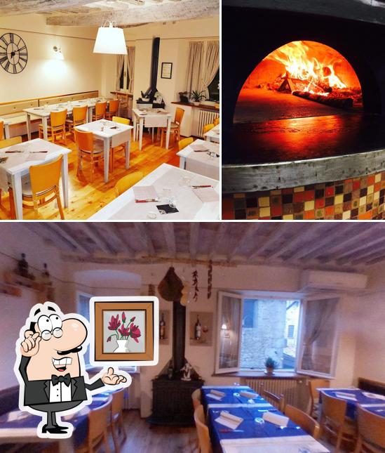 Dai un'occhiata agli interni di Pizza e Hamburger da Nilo Cetona