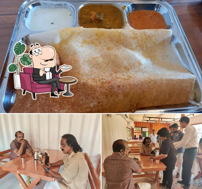 Take a seat at one of the tables at TAKE-A-BREAK @ VRINDAVAN