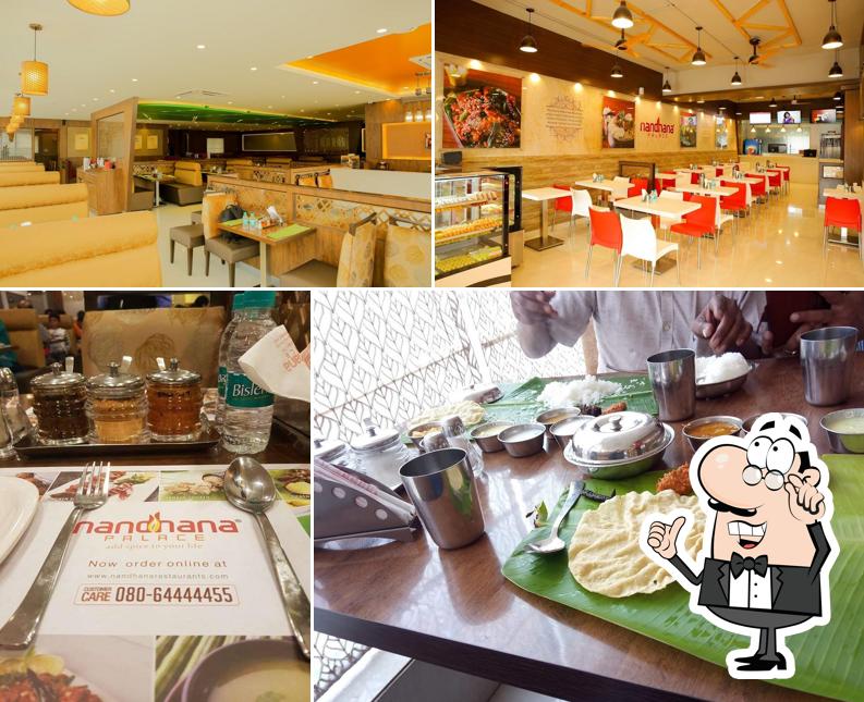Take a seat at one of the tables at Nandhana Palace - Andhra Style Restaurant - Kanakapura Road