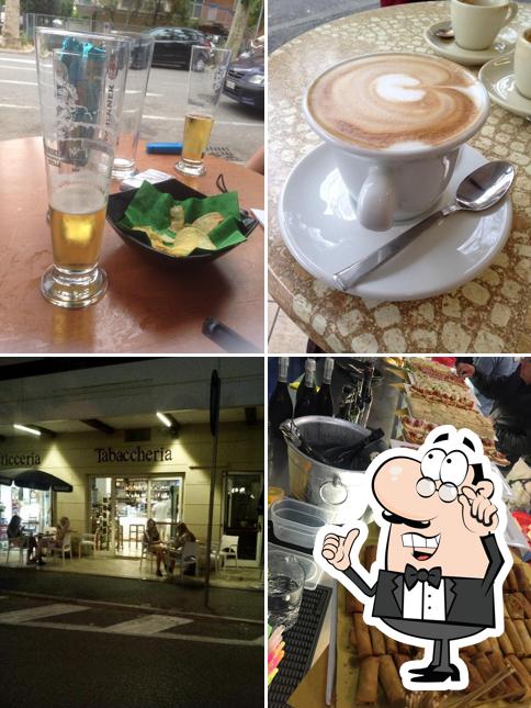 La foto della interni e bevanda di Caffè Paradise
