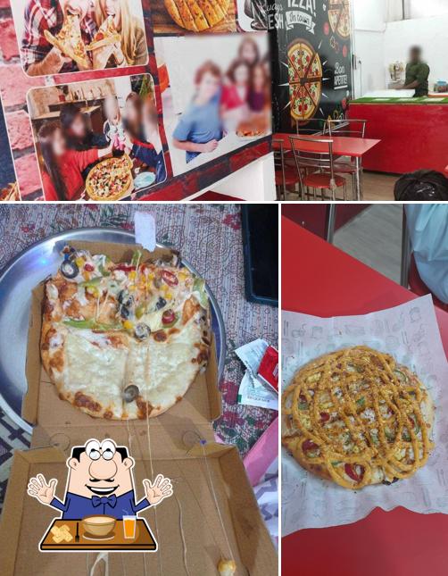 Take a look at the photo depicting food and interior at D'Manoj pizza