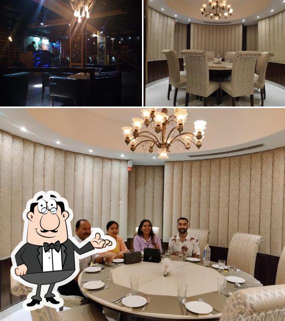 Take a seat at one of the tables at Lezzetli Fine Dine Restaurant