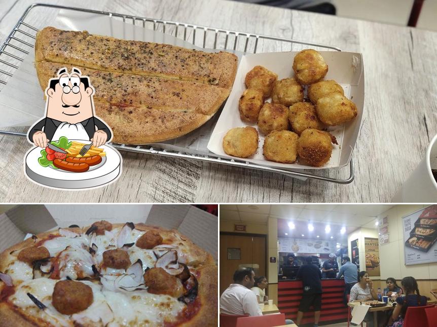Among various things one can find food and interior at Pizza Hut Mansadevi, Panchkula